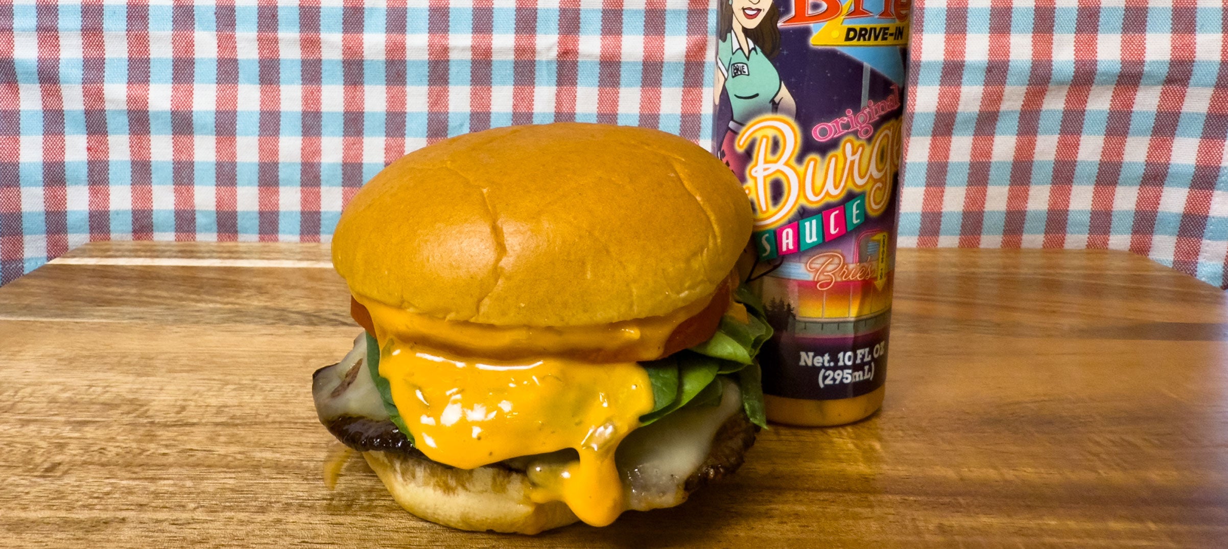 Portobello mushroom cap burger and a bottle of Brie's Drive-In Burger Sauce.