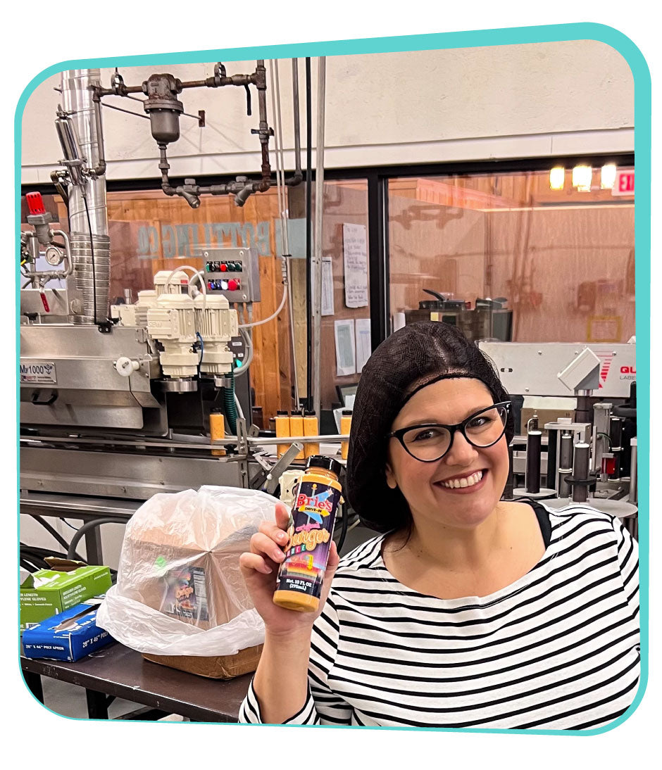 Brie Blackford working in sauce bottling plant.