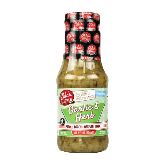 Product image: Elda's Kitchen Garlic & Herb Sauce bottle.